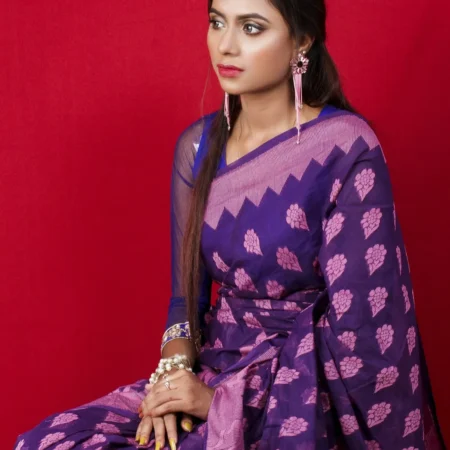 Woman in a purple Banarasi silk saree