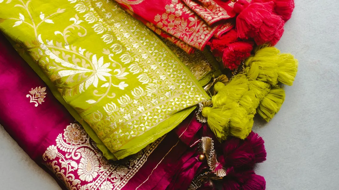 Folded silk sarees in yellow and pink