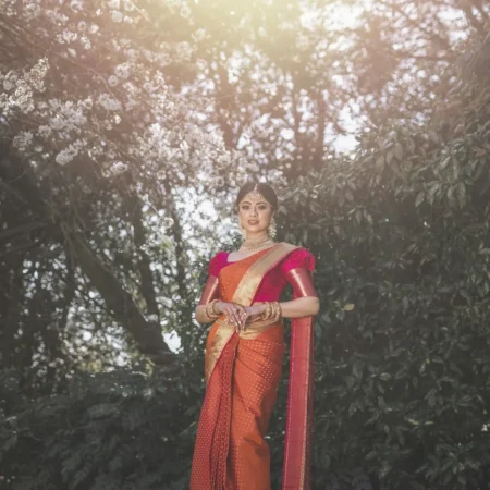 Woman in a mustard silk saree outdoors