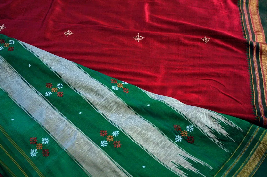 Handwoven cotton saree with a red border