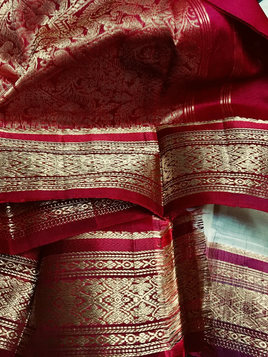 Close-up of a red and gold zari border