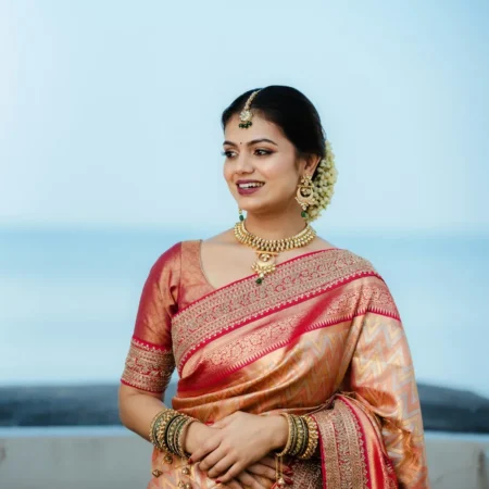 Woman in a golden bridal silk saree