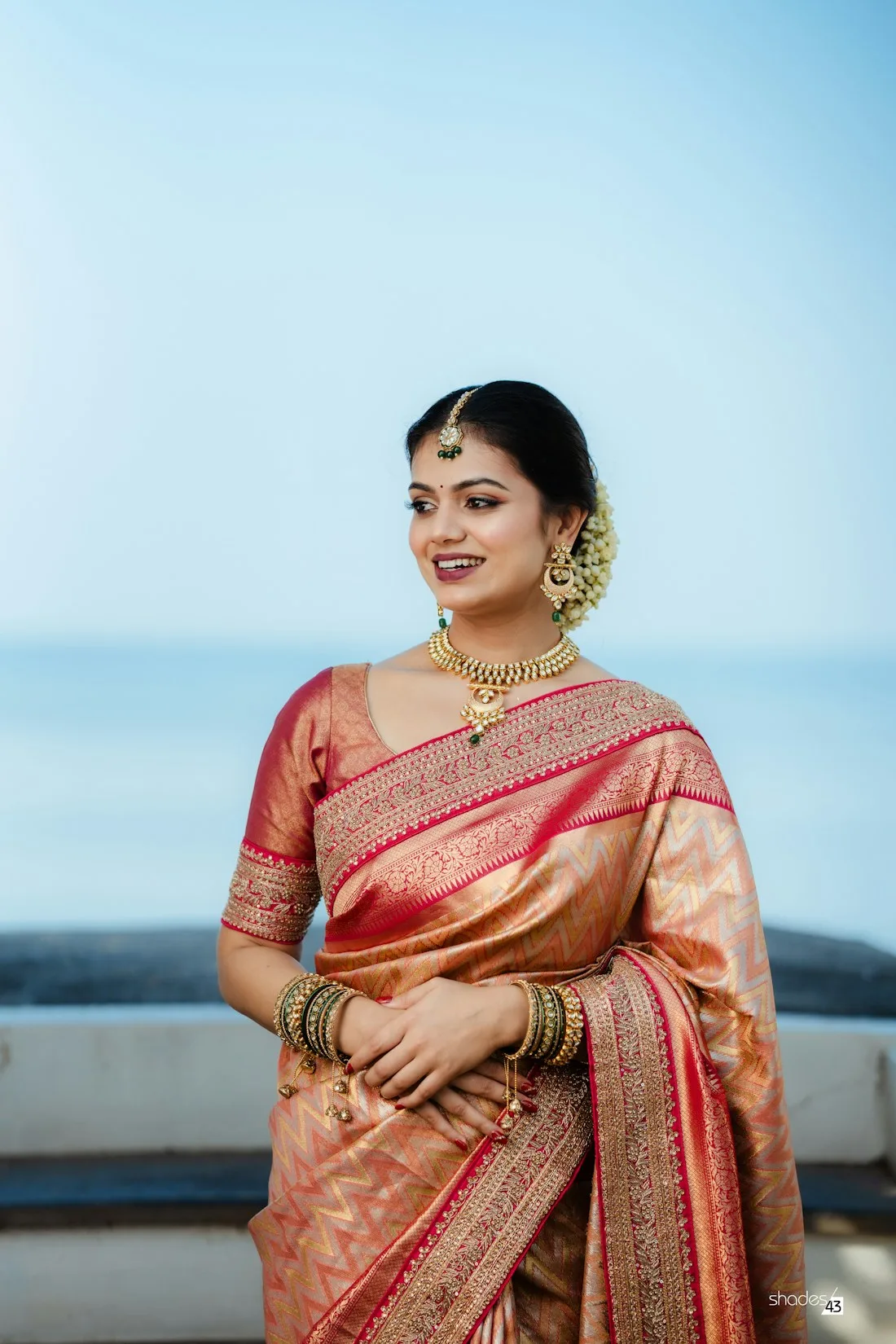 Woman in a golden bridal silk saree