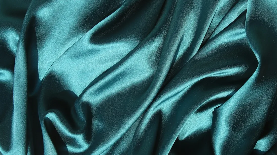 Teal silk fabric close-up